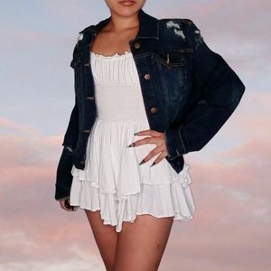 Dark blue denim jacket with distressing